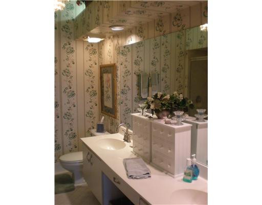 9727 Tavernier Drive Boca Raton, FL 33496 - Photo 8 of 16 a bathroom with a sink and a mirror