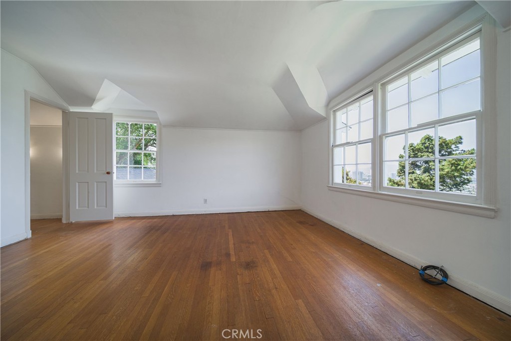 1625 Campbell Street Glendale, CA 91207 - Photo 15 of 19 an empty room with wooden floor and windows