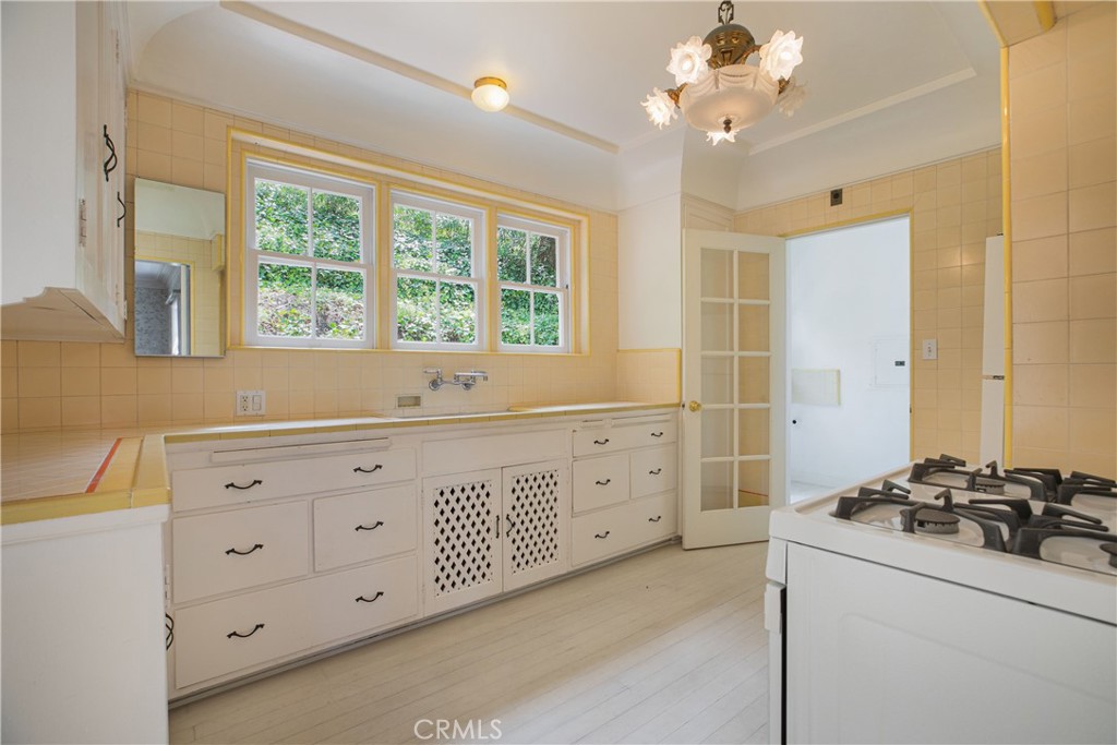 1625 Campbell Street Glendale, CA 91207 - Photo 6 of 19 a kitchen with sink a stove and a refrigerator