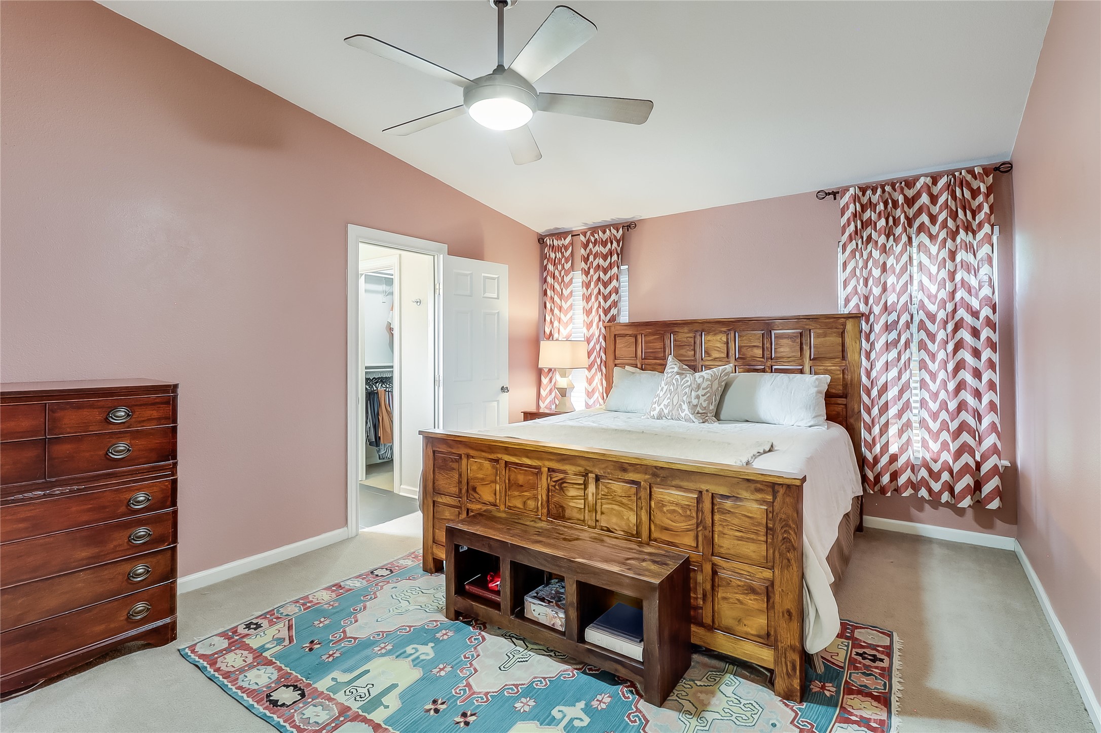 7300 Glenhill Road Austin, TX 78752 - Photo 17 of 37 a bed sitting in a bedroom next to a window with a dresser