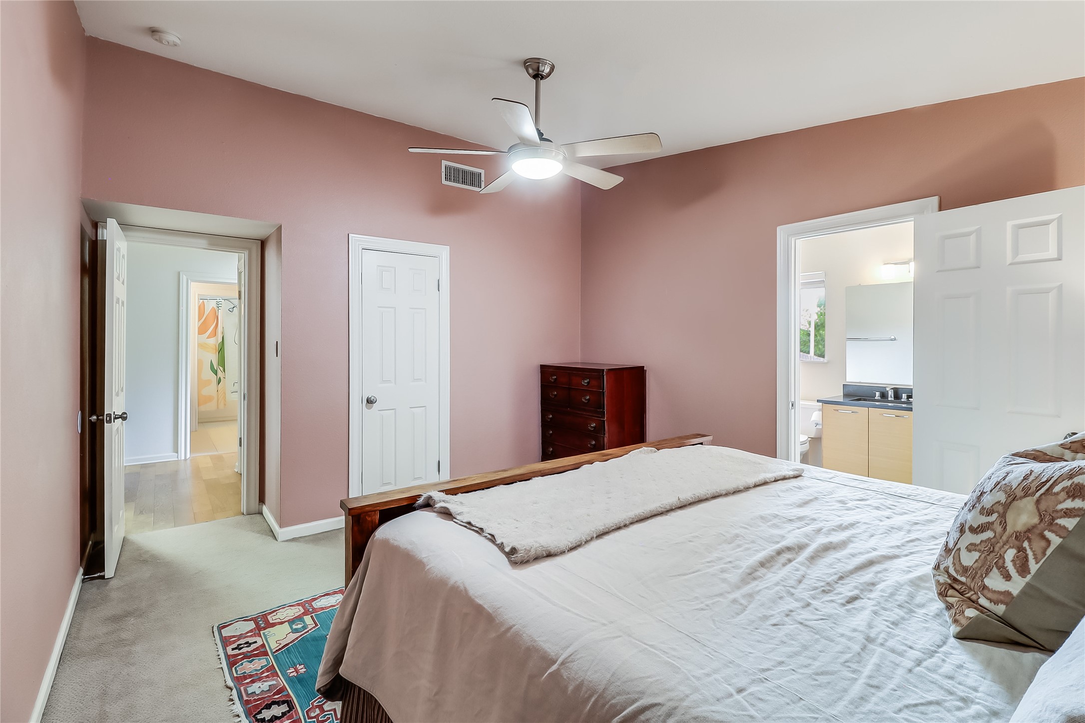 7300 Glenhill Road Austin, TX 78752 - Photo 18 of 37 a bedroom with a bed and a chandelier