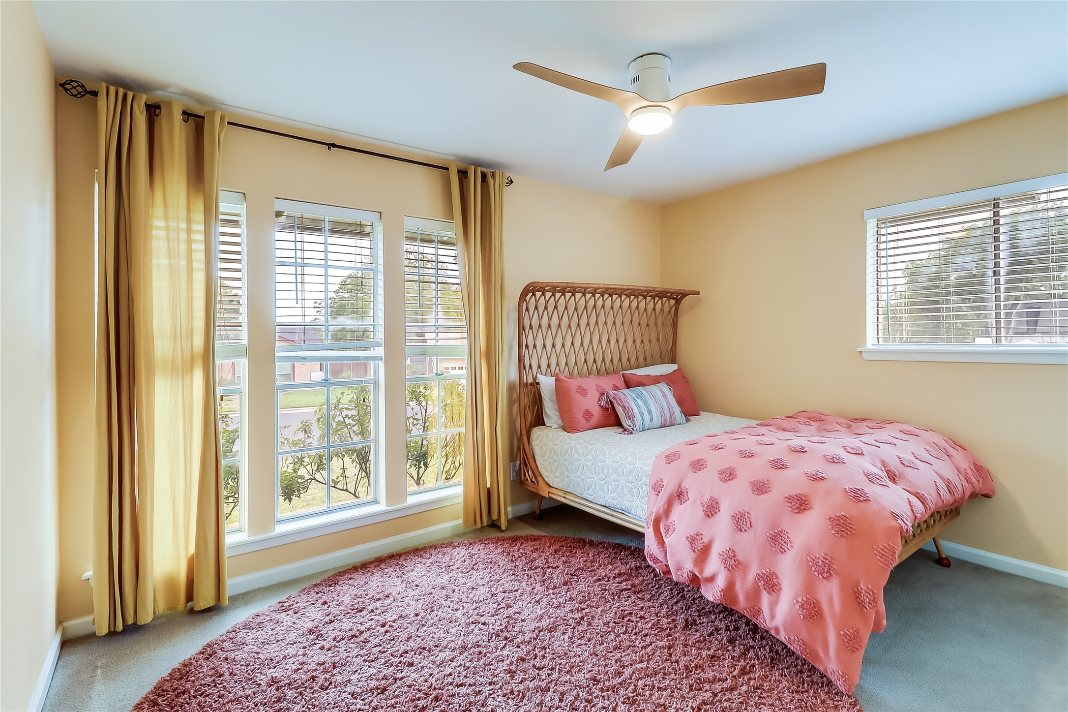 7300 Glenhill Road Austin, TX 78752 - Photo 21 of 37 a bedroom with a bed next to a window