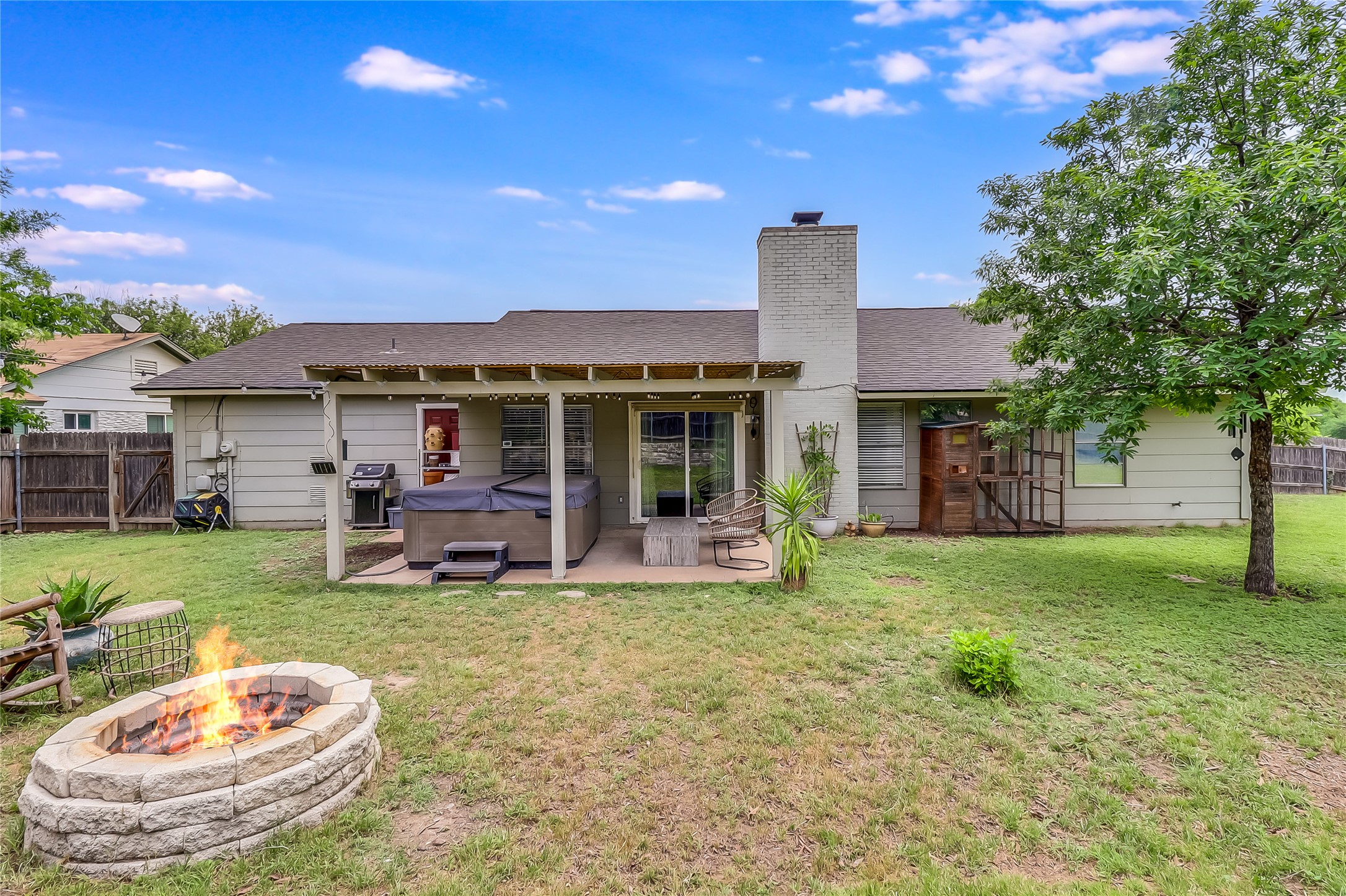7300 Glenhill Road Austin, TX 78752 - Photo 32 of 37 a view of a house with a backyard porch and sitting area