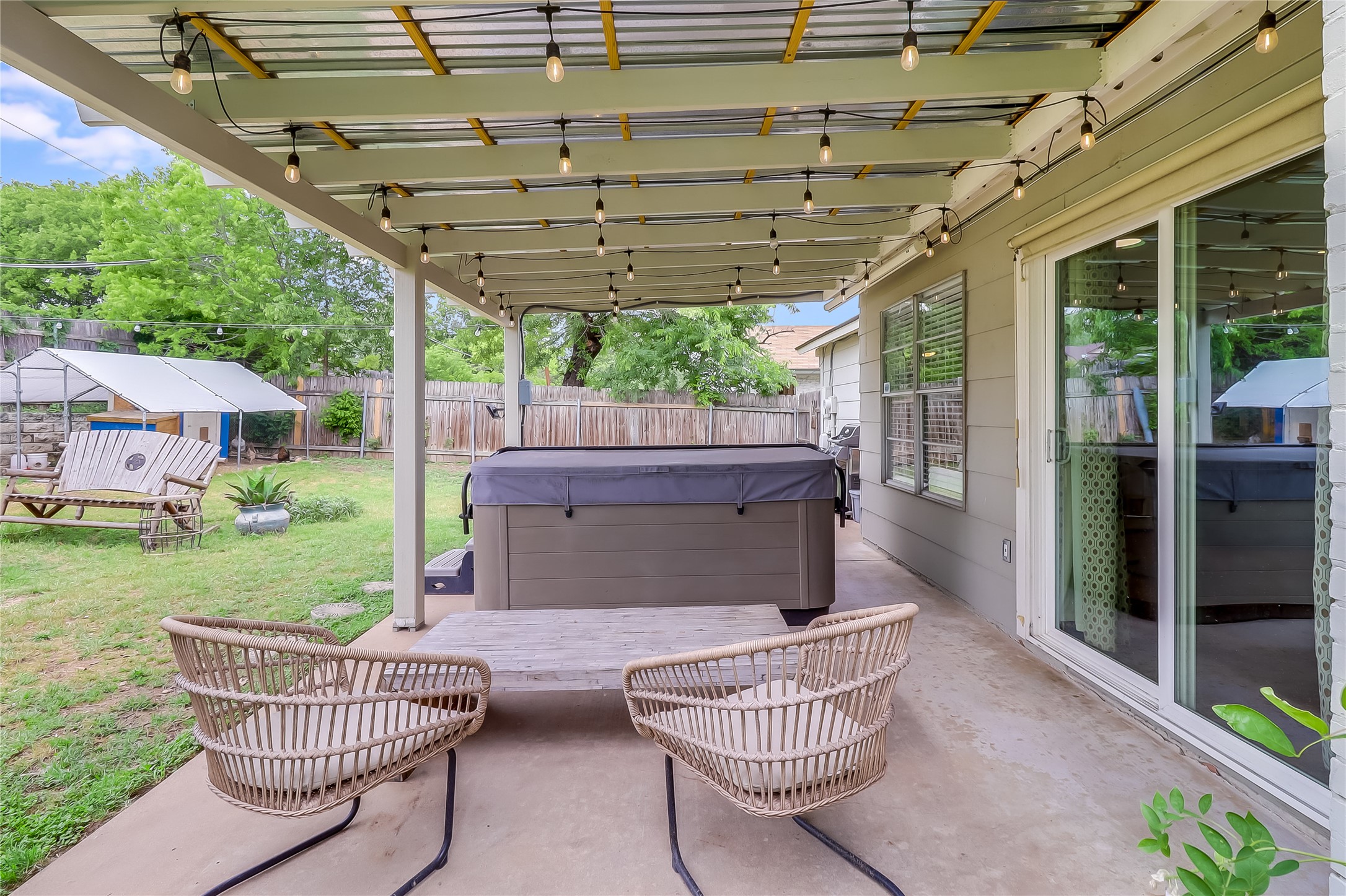 7300 Glenhill Road Austin, TX 78752 - Photo 33 of 37 a view of a chair and tables in the patio next to a yard