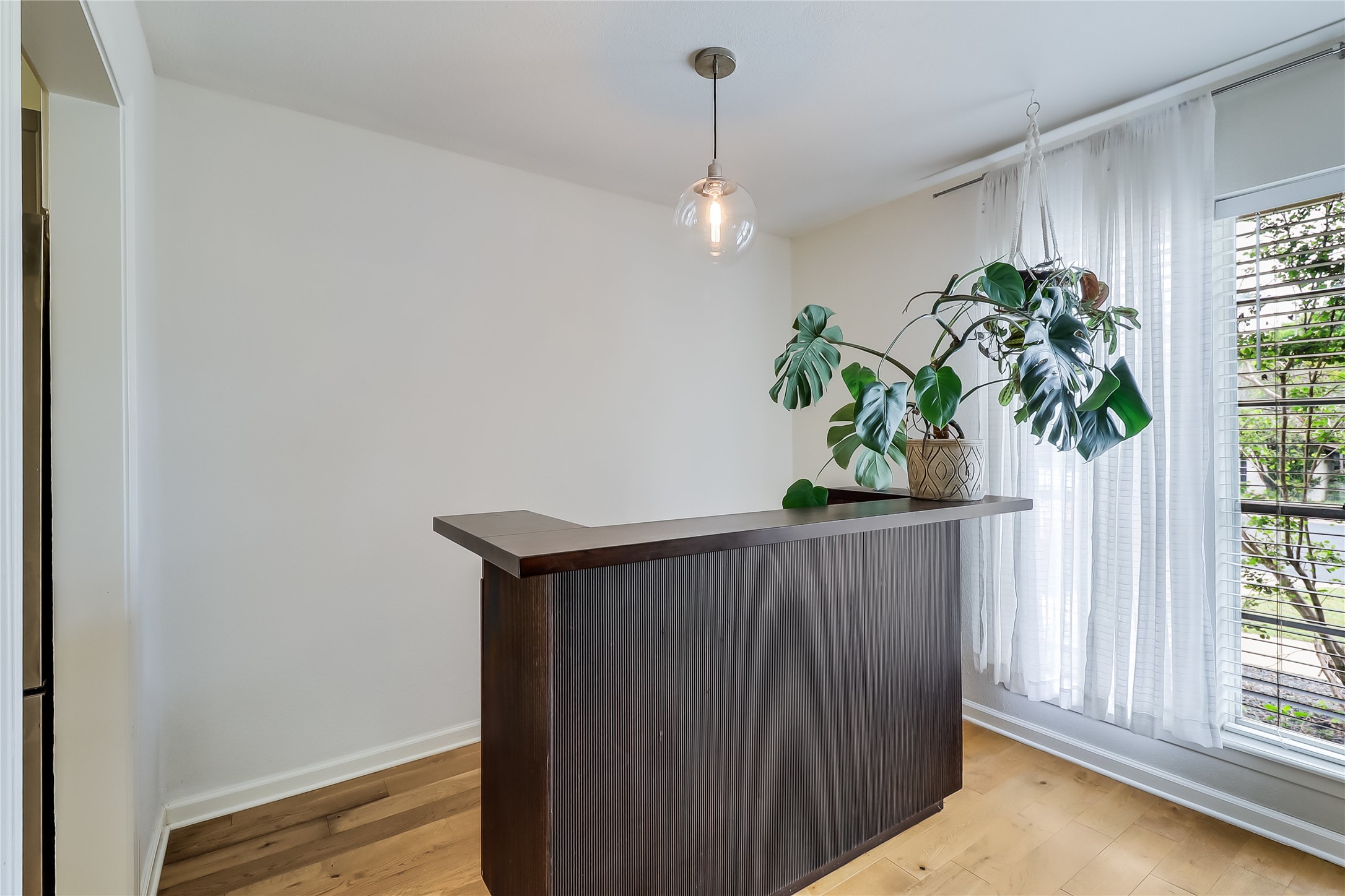 7300 Glenhill Road Austin, TX 78752 - Photo 10 of 37 a view of a hallway with wooden floor