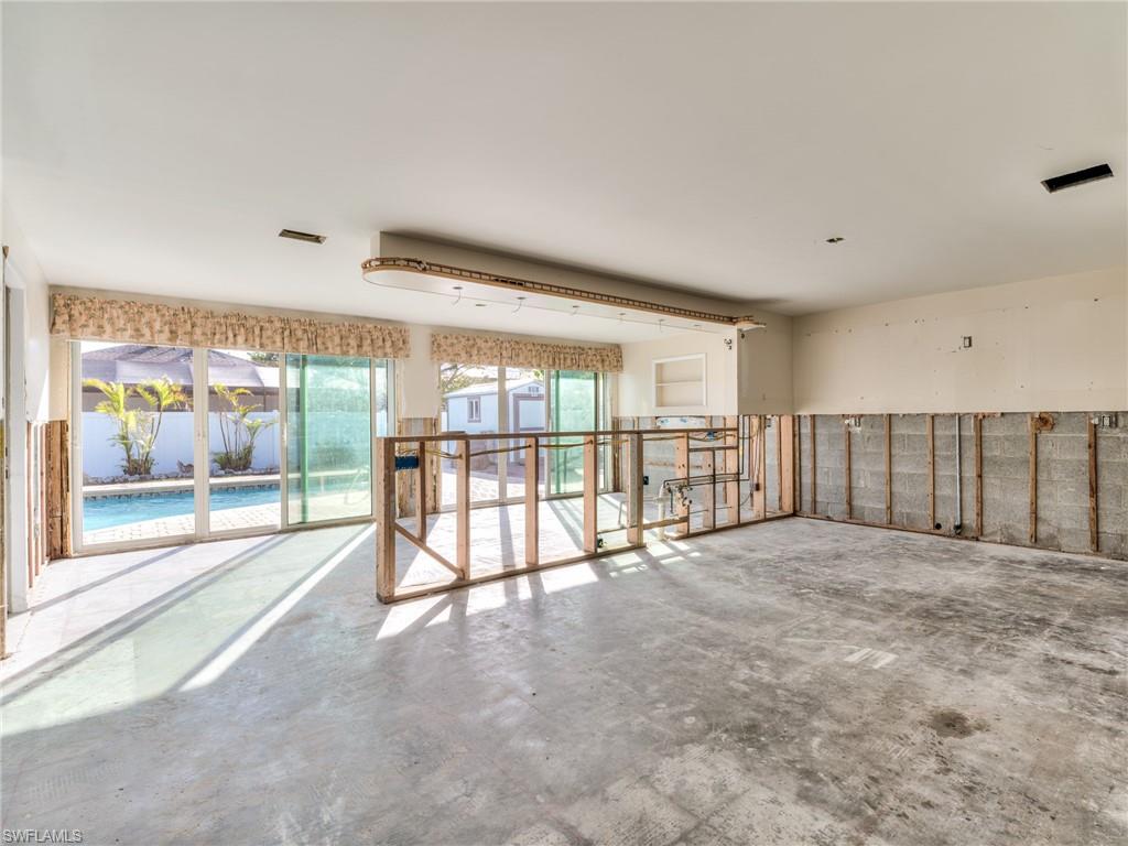 20621 Coconut Drive Estero, FL 33928 - Photo 18 of 37 a view of an empty room with a large window
