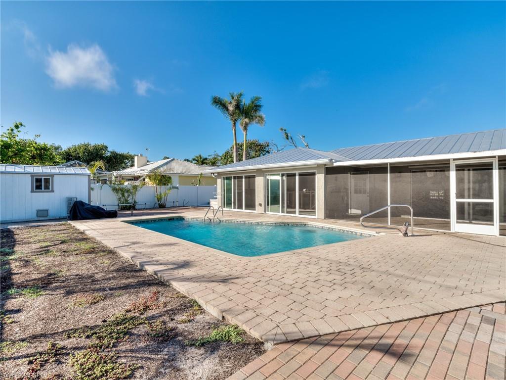 20621 Coconut Drive Estero, FL 33928 - Photo 32 of 37 a front view of a house with a yard
