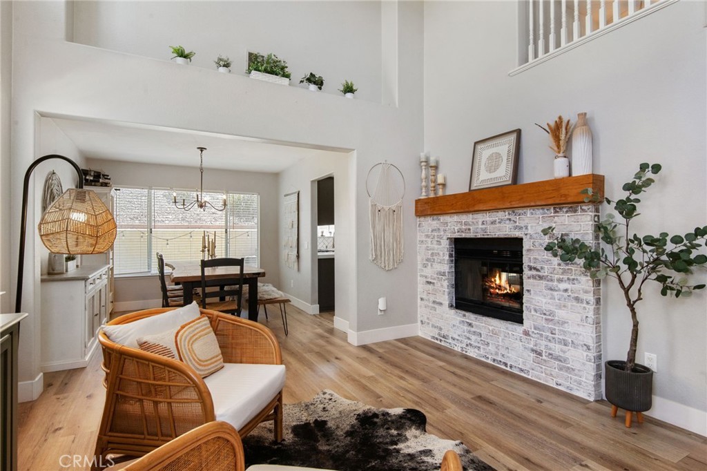 40456 Windsor Road Temecula, CA 92591 - Photo 1 of 38 a living room with furniture a fireplace and a potted plant