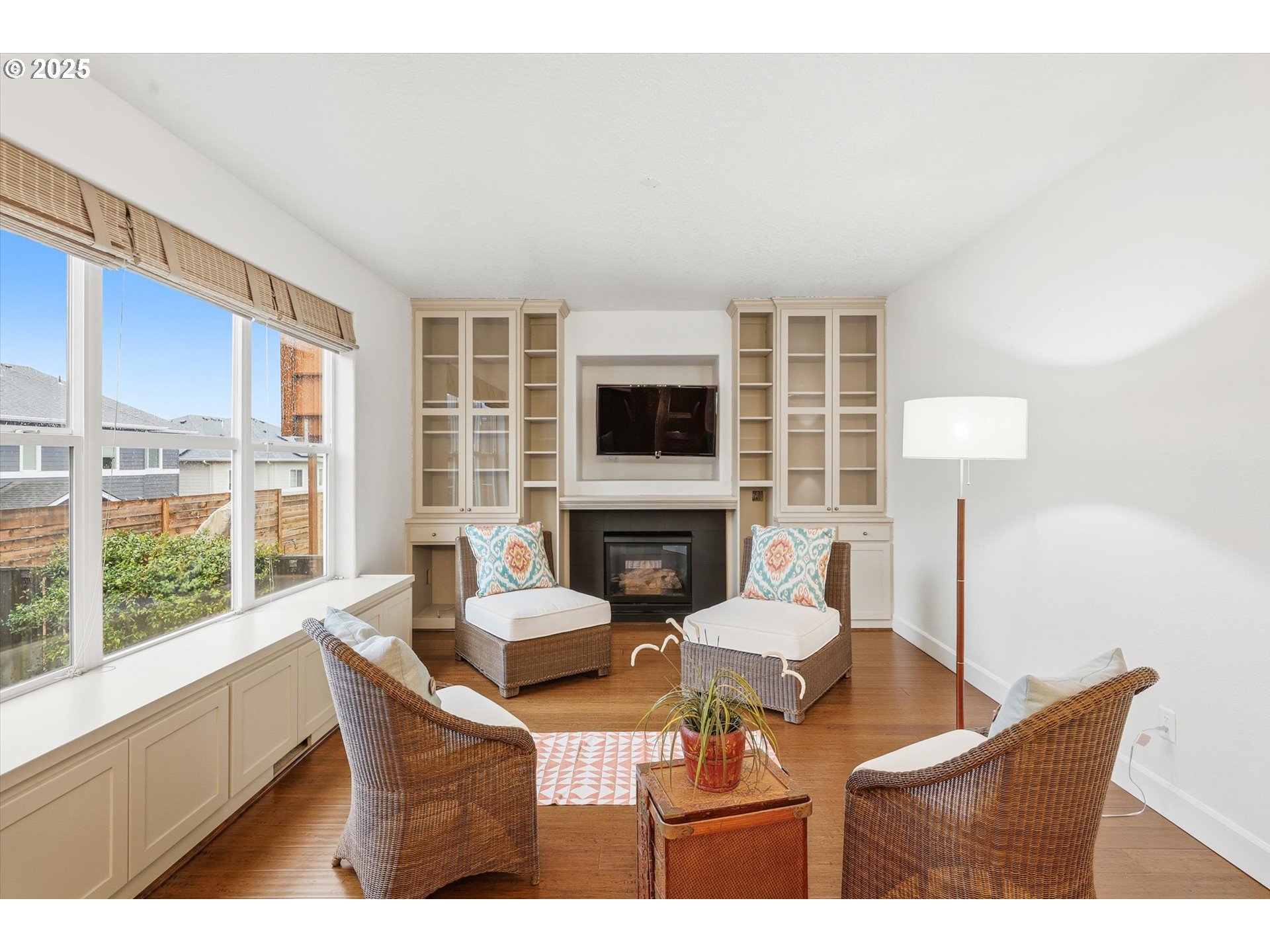 13765 Southwest Florentine Avenue Portland, OR 97223 - Photo 16 of 34 a living room with fireplace furniture and a large window
