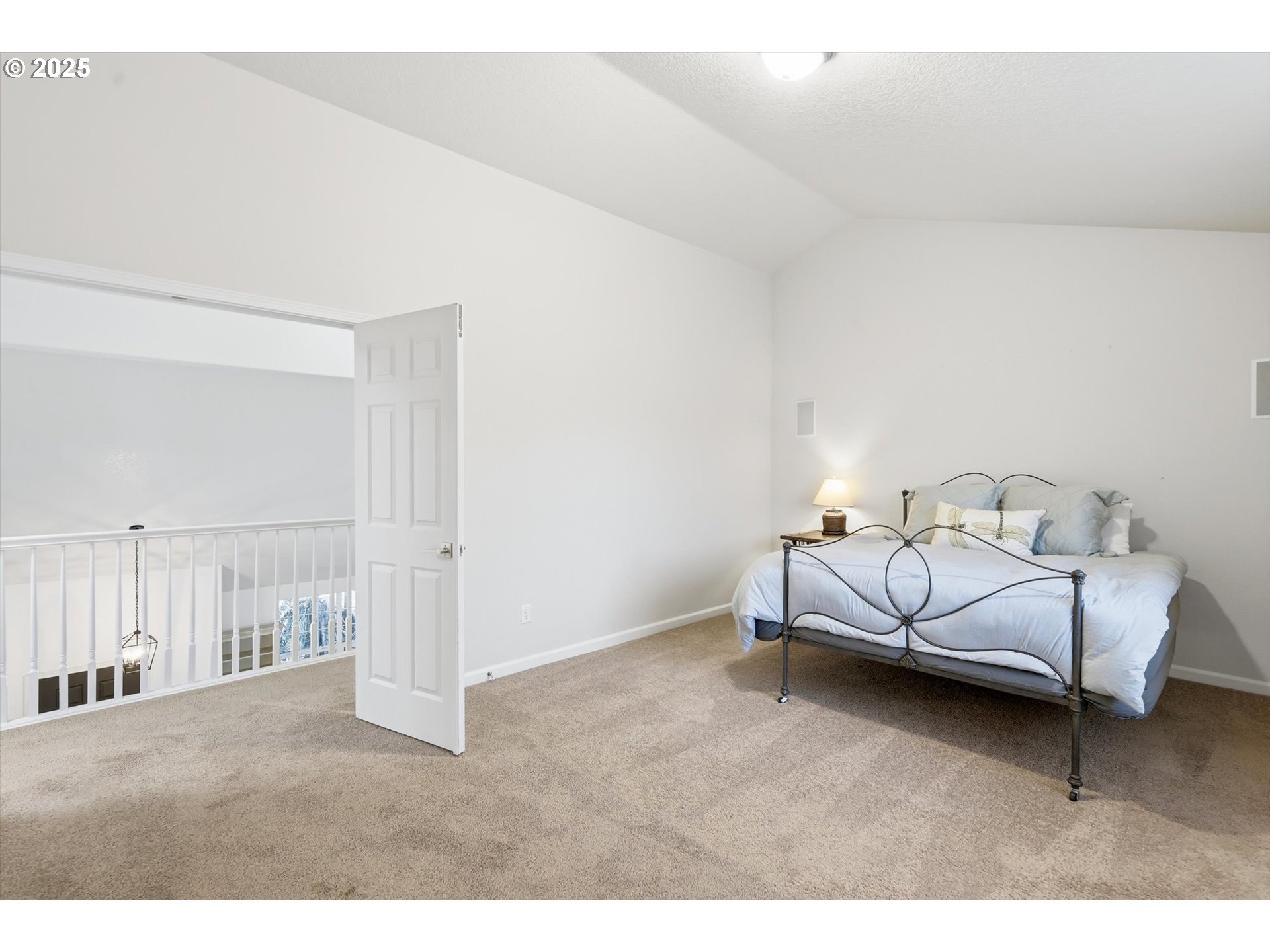 13765 Southwest Florentine Avenue Portland, OR 97223 - Photo 20 of 34 a bedroom with bed and a night stand