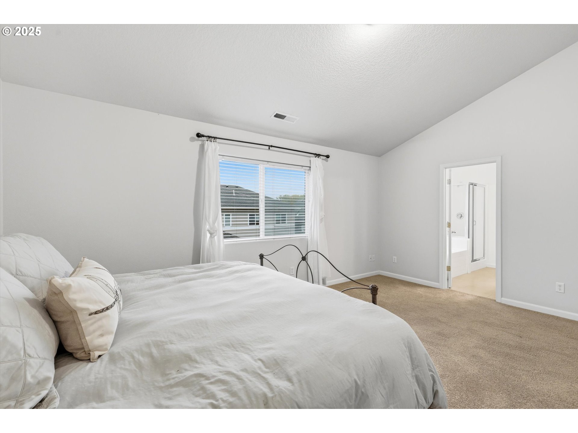 13765 Southwest Florentine Avenue Portland, OR 97223 - Photo 21 of 34 a bedroom with a bed and a window