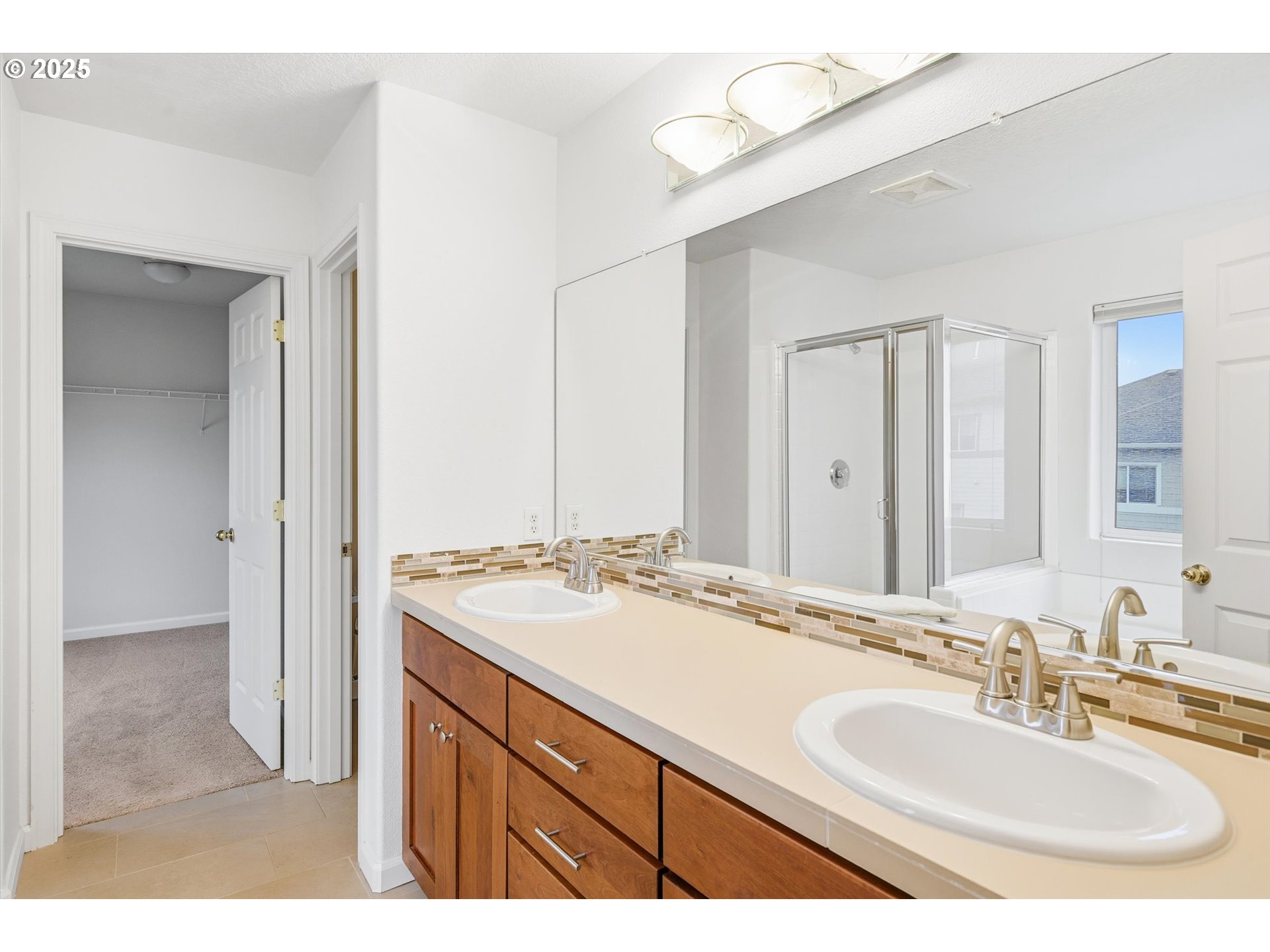 13765 Southwest Florentine Avenue Portland, OR 97223 - Photo 22 of 34 a bathroom with a sink and a mirror