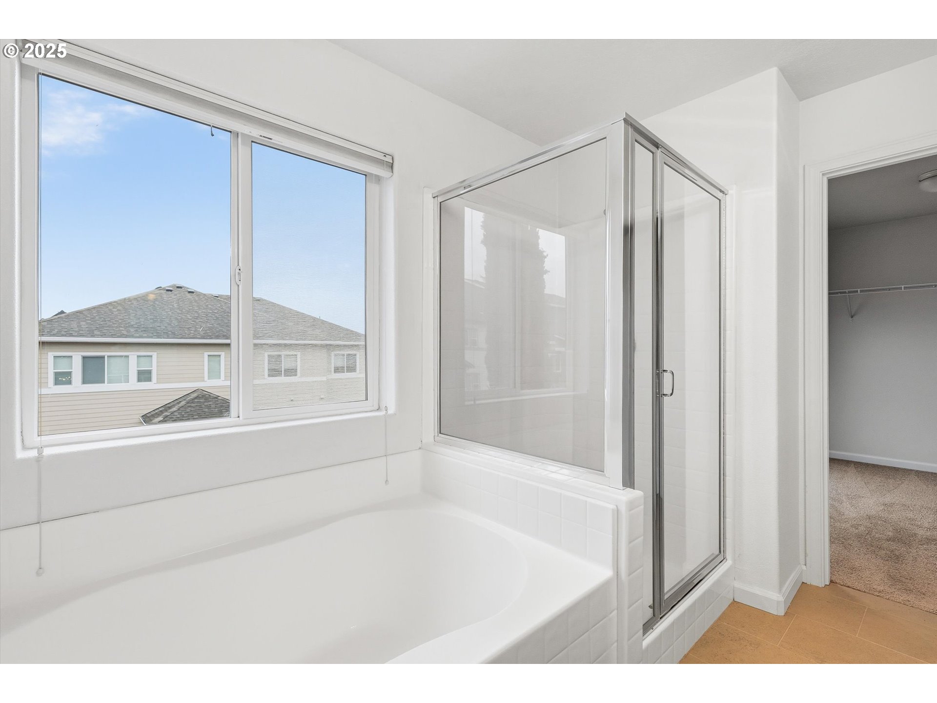 13765 Southwest Florentine Avenue Portland, OR 97223 - Photo 23 of 34 a bathroom with a bathtub and a shower