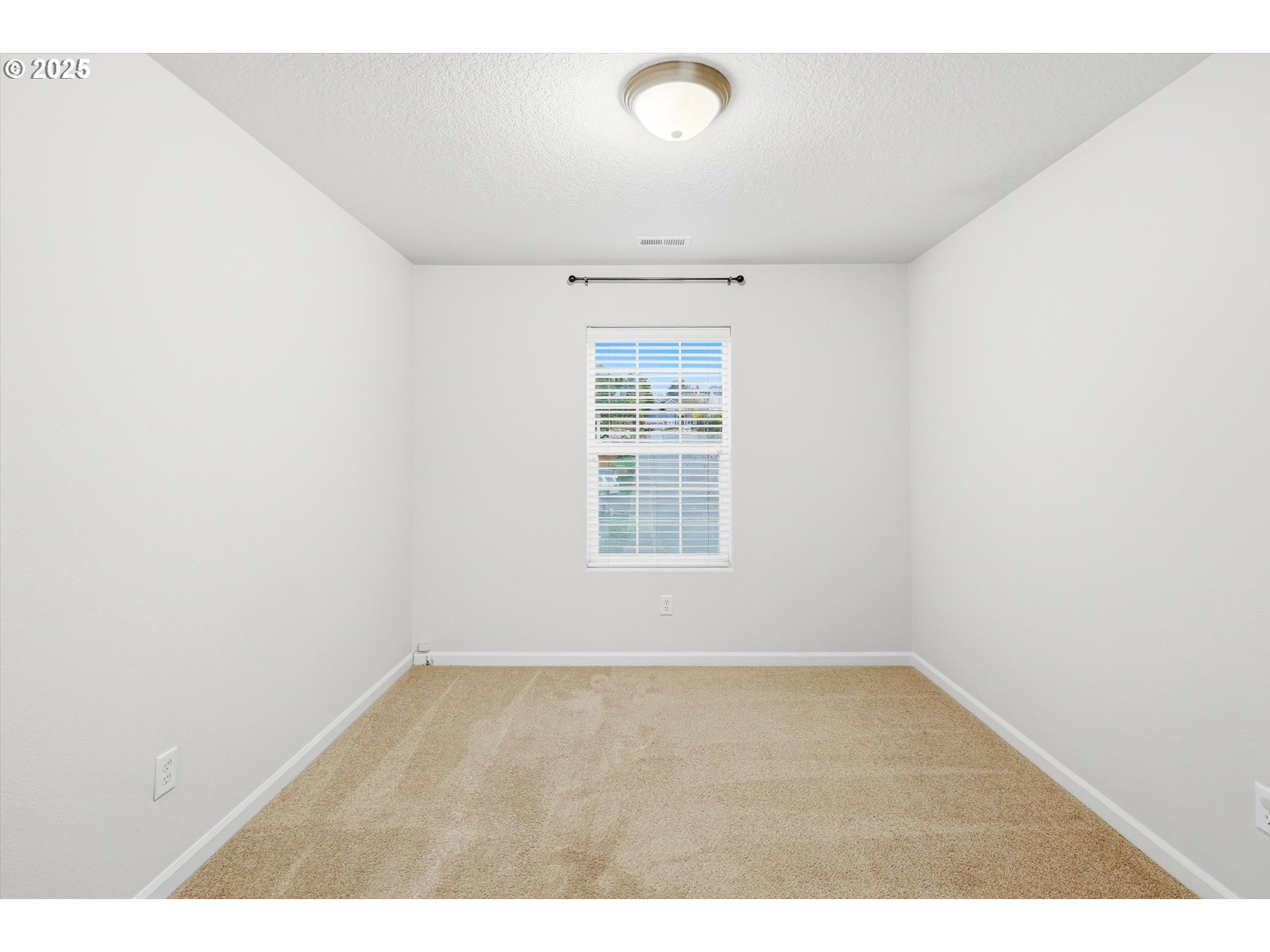 13765 Southwest Florentine Avenue Portland, OR 97223 - Photo 26 of 34 an empty room with wooden floor and windows