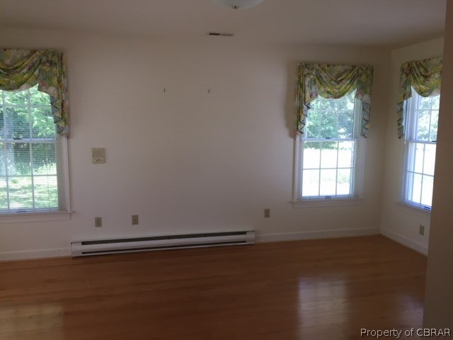 769 Greys Point Road Topping, VA 23169 - Photo 7 of 15 Living room with beautiful Pine floors