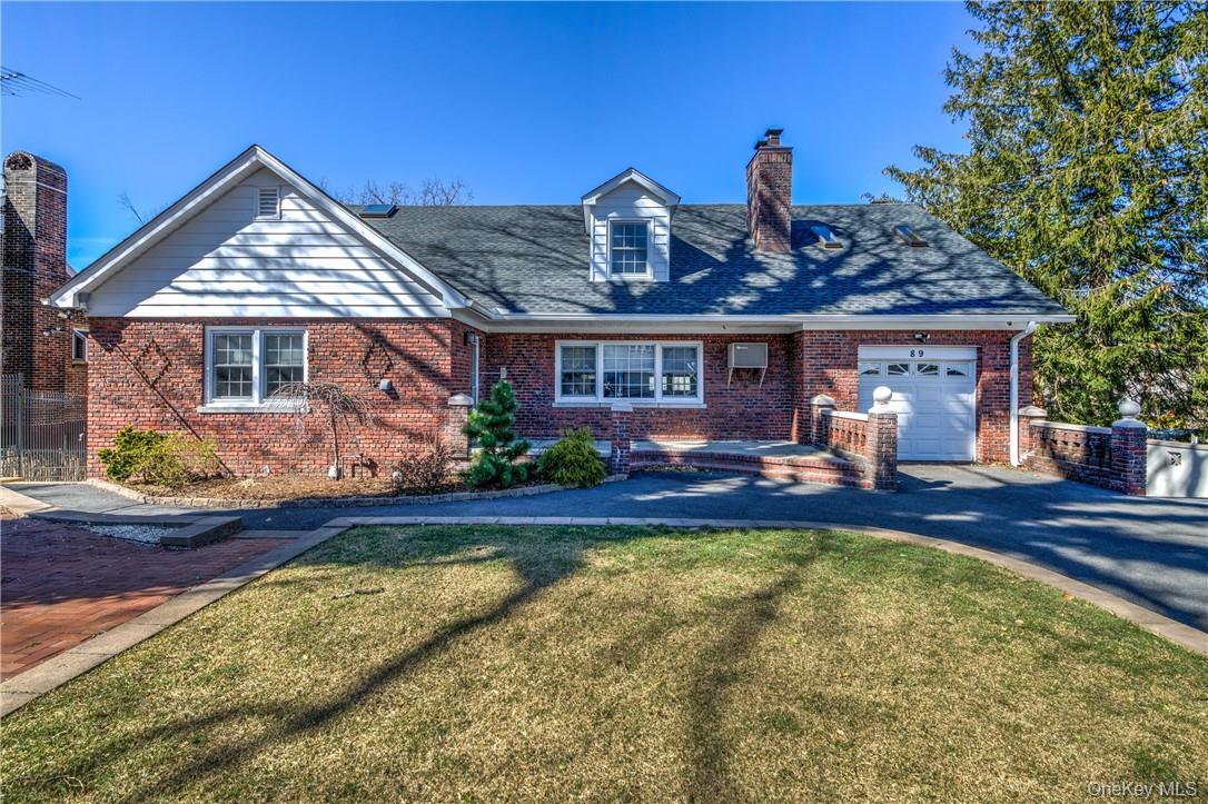 89 Ridgewood Avenue, Unit 1 Yonkers, NY 10704 - Photo 1 of 1 a view of a house with swimming pool and sitting area