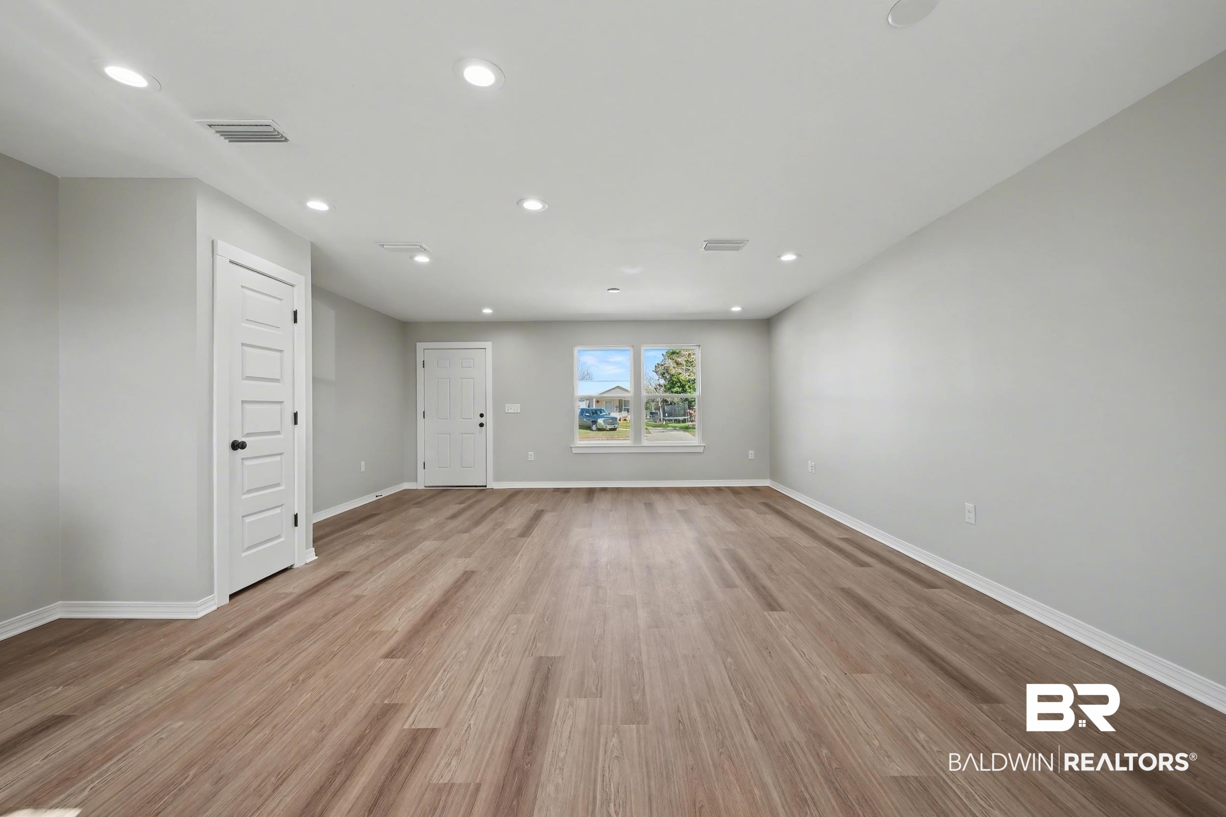 76 Fincher Lane Loxley, AL 36551 - Photo 9 of 33 Unfurnished room featuring light wood-style flooring and recessed lighting