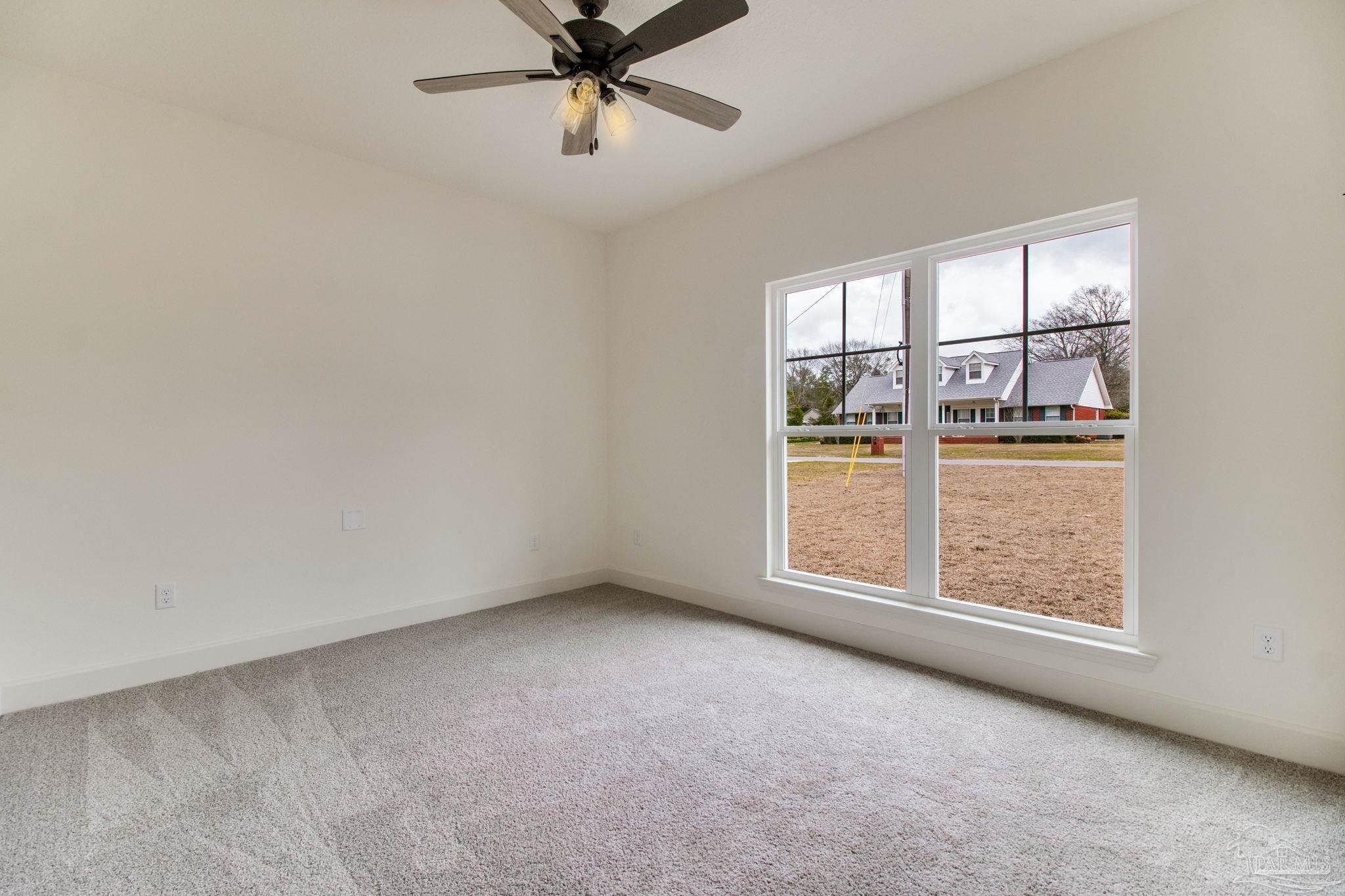 4310 Watkins Street Pace, FL 32571 - Photo 56 of 58 an empty room with a window