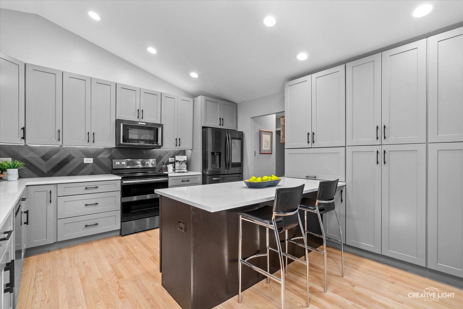 838 Havenshire Road Naperville, IL 60565 - Photo 11 of 48 a kitchen with kitchen island granite countertop wooden cabinets and stainless steel appliances