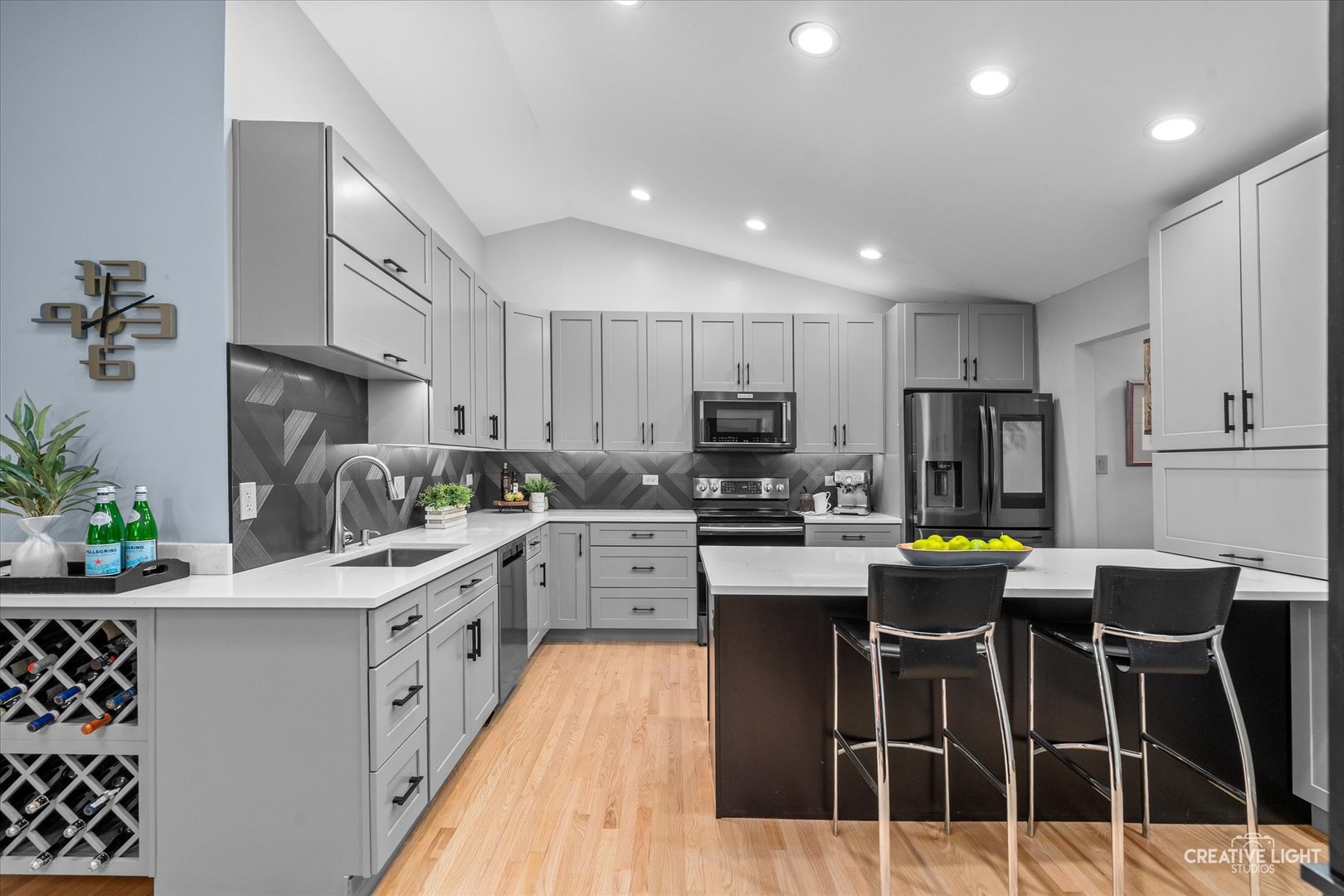 838 Havenshire Road Naperville, IL 60565 - Photo 13 of 48 a kitchen with stainless steel appliances kitchen island granite countertop a refrigerator sink and white cabinets
