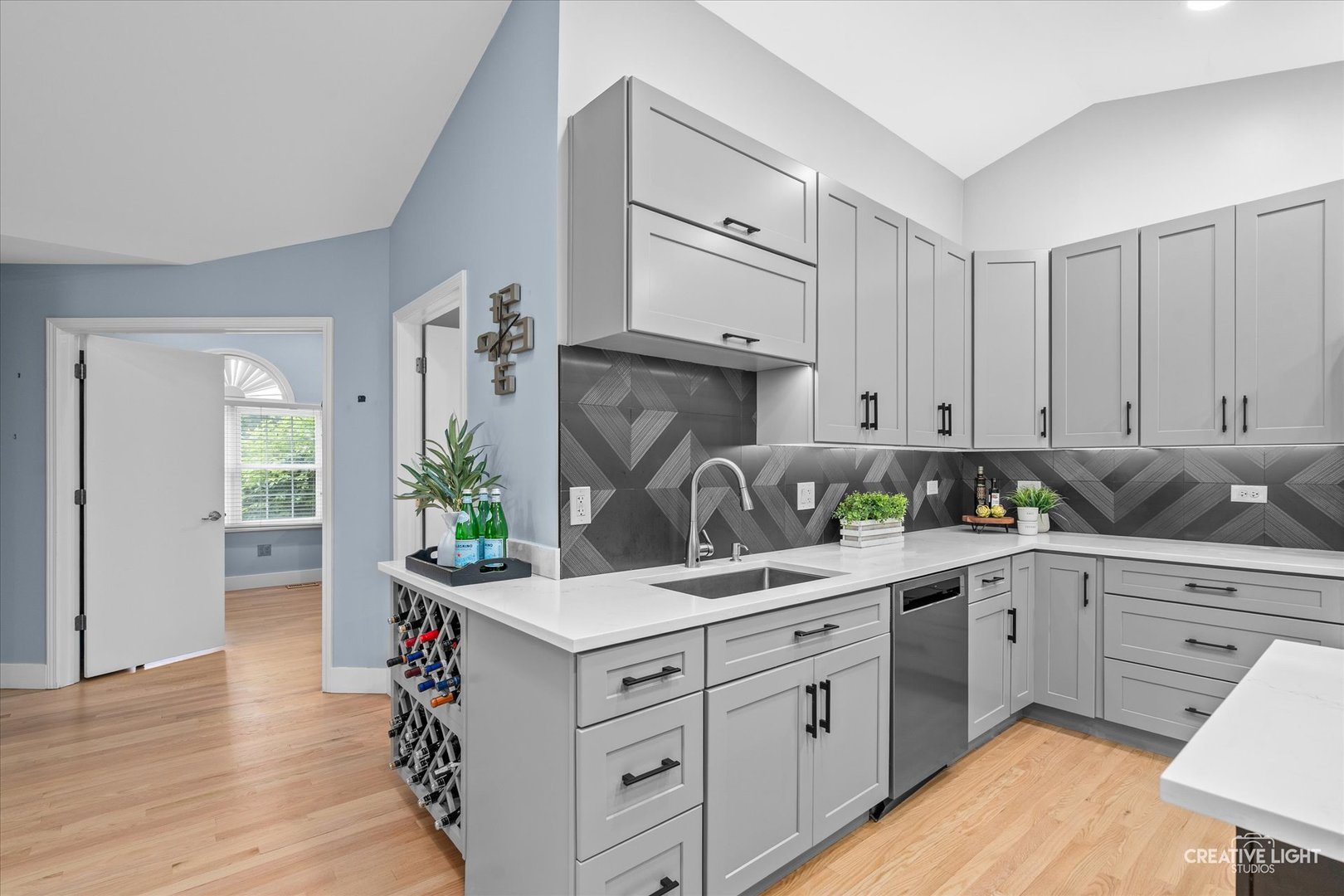 838 Havenshire Road Naperville, IL 60565 - Photo 14 of 48 a kitchen with a sink dishwasher stove and white cabinets