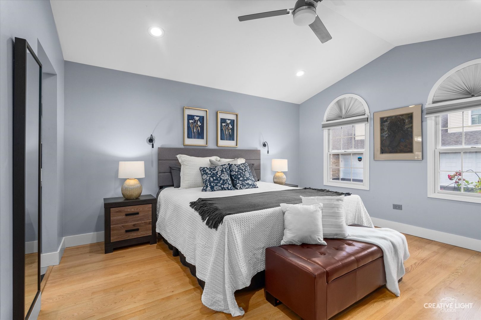 838 Havenshire Road Naperville, IL 60565 - Photo 24 of 48 a bedroom with a bed and a chandelier