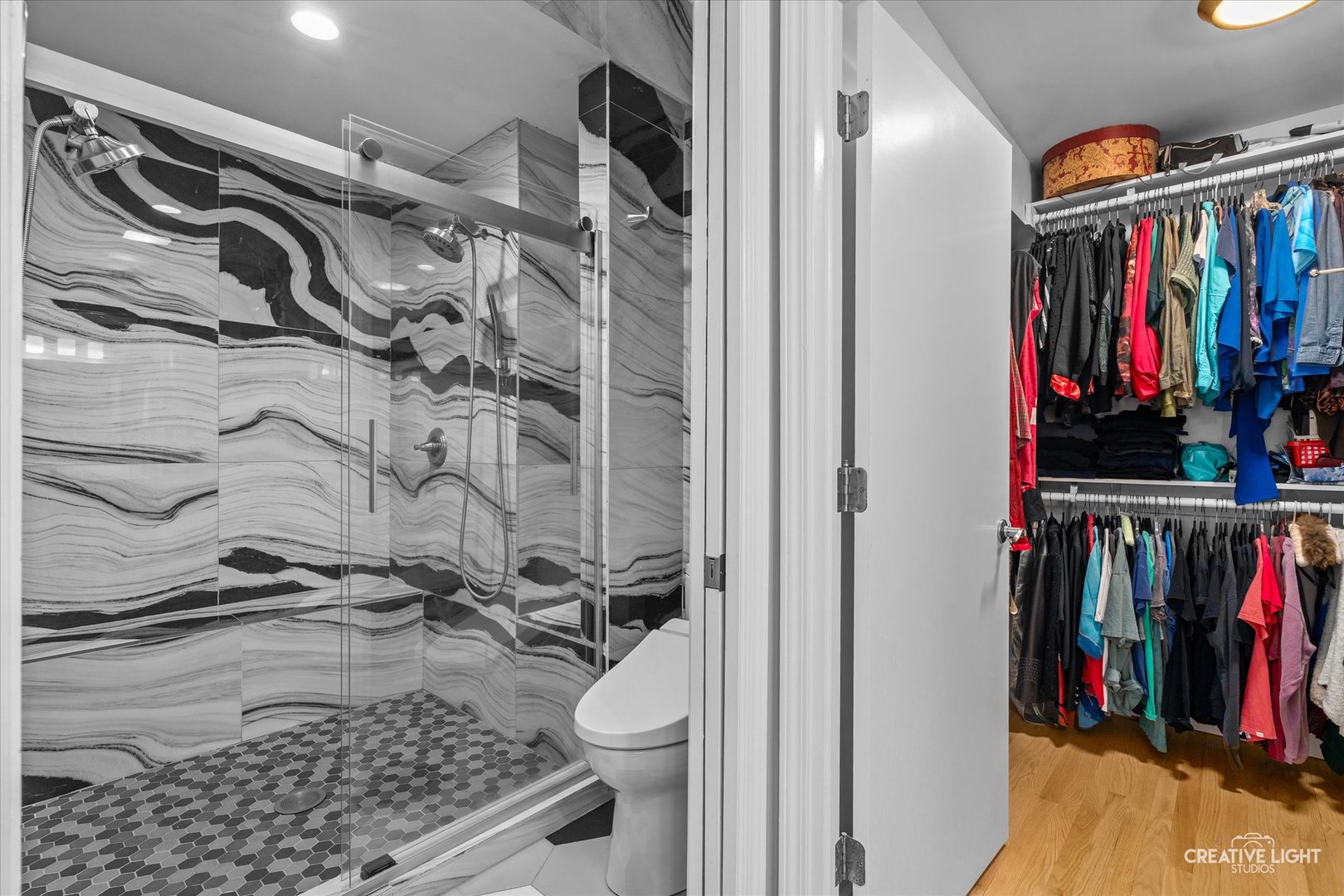 838 Havenshire Road Naperville, IL 60565 - Photo 26 of 48 a view of walk in closet with clothes and shoes