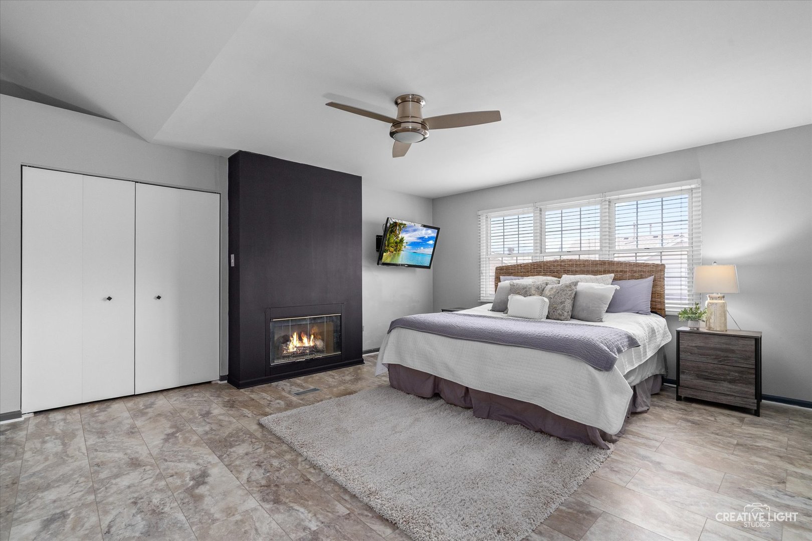 838 Havenshire Road Naperville, IL 60565 - Photo 30 of 48 a spacious bedroom with a bed and a ceiling fan