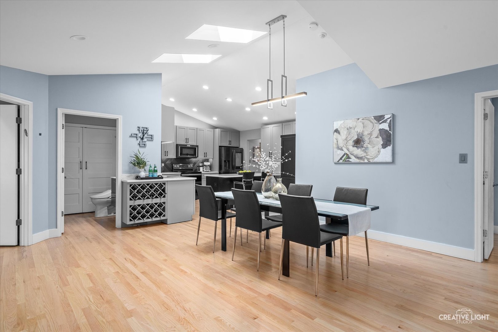 838 Havenshire Road Naperville, IL 60565 - Photo 3 of 48 a living room with furniture and kitchen view