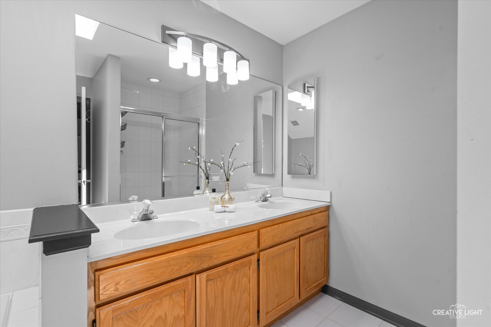 838 Havenshire Road Naperville, IL 60565 - Photo 31 of 48 a bathroom with a sink double vanity and a mirror