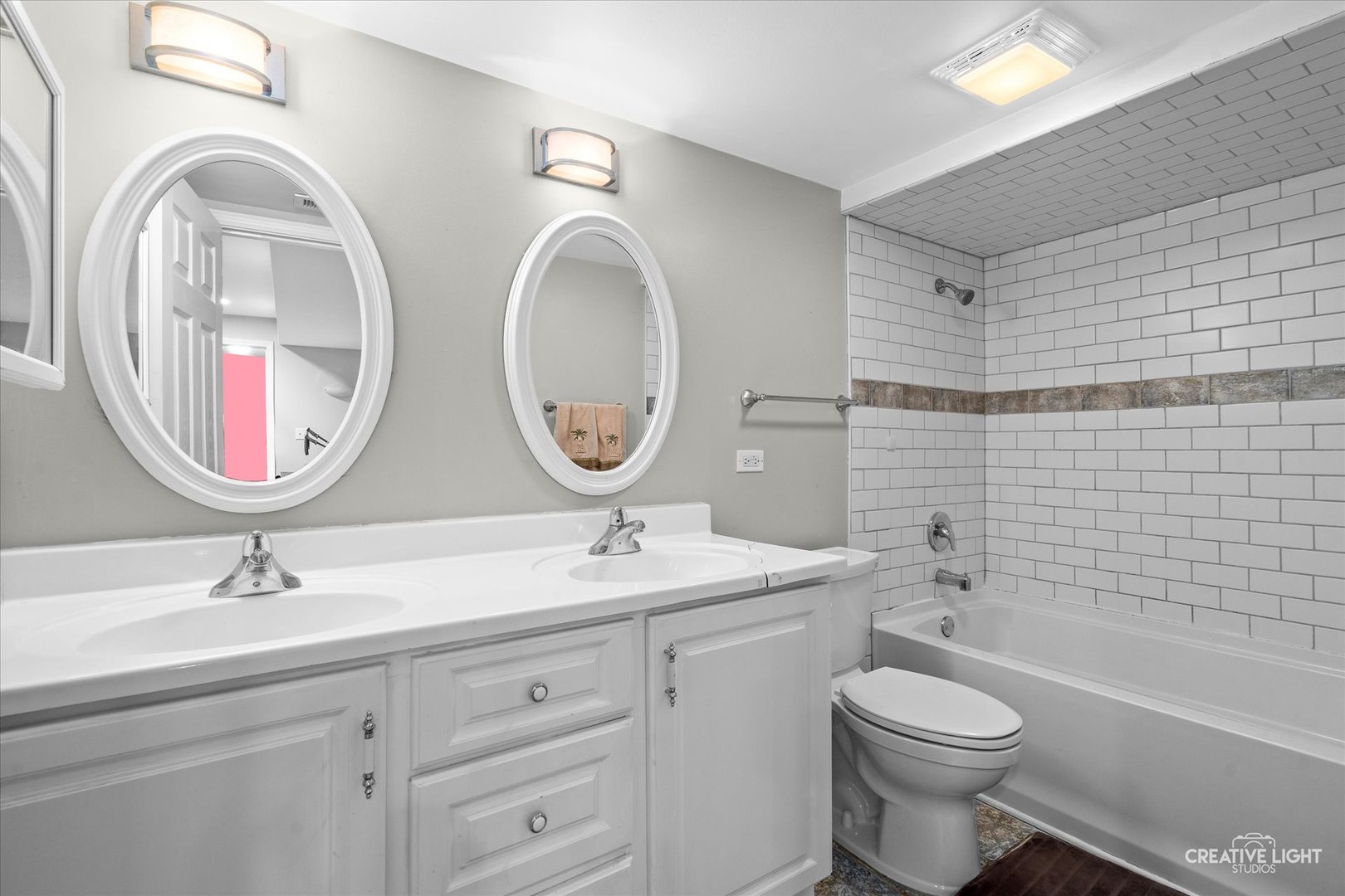 838 Havenshire Road Naperville, IL 60565 - Photo 37 of 48 a bathroom with a toilet a double vanity sink and a mirror