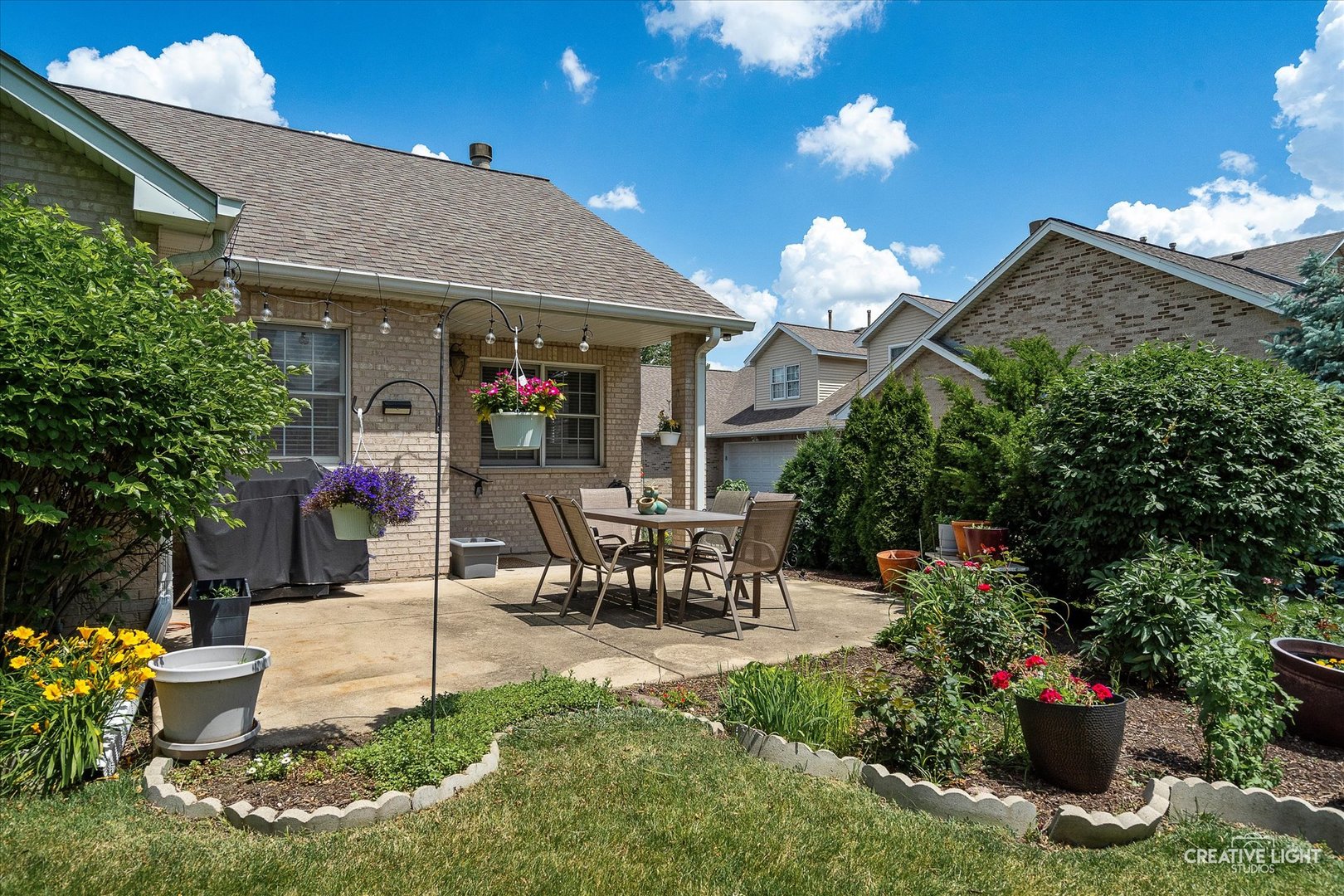838 Havenshire Road Naperville, IL 60565 - Photo 40 of 48 a view of a patio with table and chairs potted plants