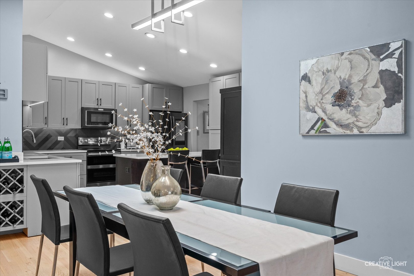 838 Havenshire Road Naperville, IL 60565 - Photo 9 of 48 a kitchen with kitchen island a appliances dining table and chairs