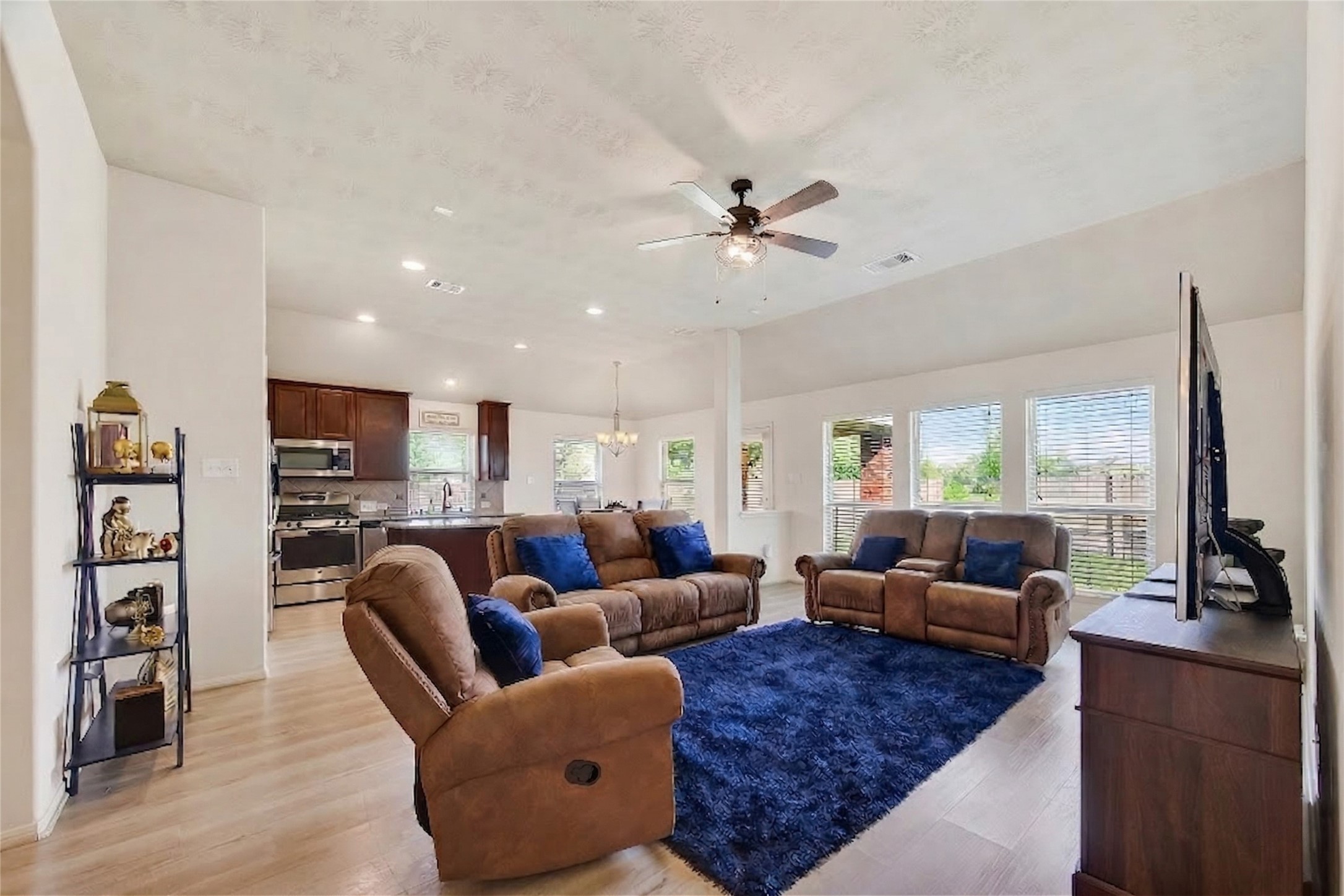 13415 Star Creek Lane Rosharon, TX 77583 - Photo 11 of 46 a living room with furniture kitchen view and a large window