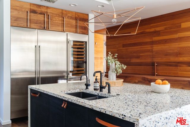 a view of backyard of house with outdoor seating