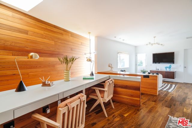 a bed room with a bed and a chair