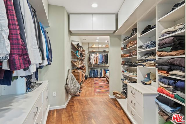 a bed room with a bed and a book shelf