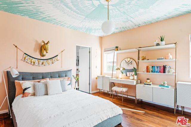 a view of swimming pool with outdoor seating and floor to ceiling window