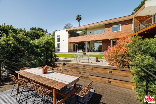 a view of a house with basketball court