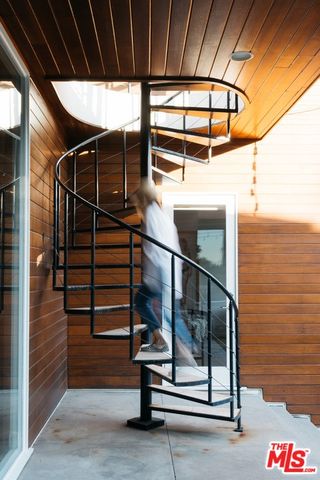 an aerial view of a house with a lake view