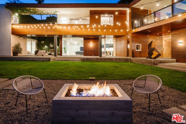 a view of a patio with swimming pool table and chairs