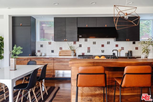 a kitchen with sink and window