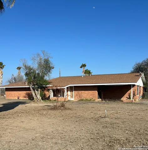 a view of a house with a road