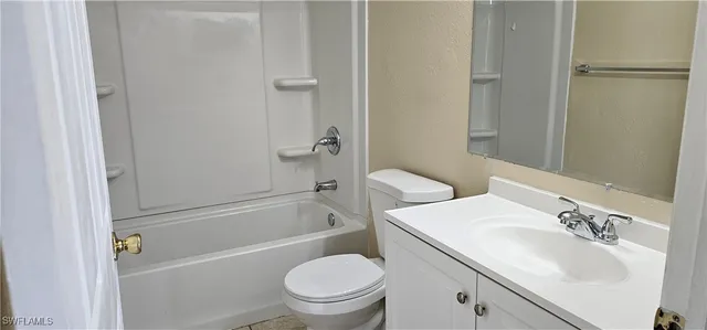 a bathroom with a sink a toilet and a shower