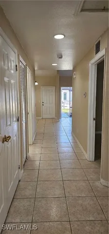 a view of livingroom with an empty space and window