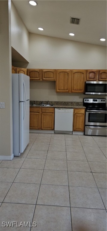 4731 15th Street Southwest Lehigh Acres, FL 33973 - Photo 7 of 19 a large kitchen with stainless steel appliances granite countertop a large stove top oven and cabinets