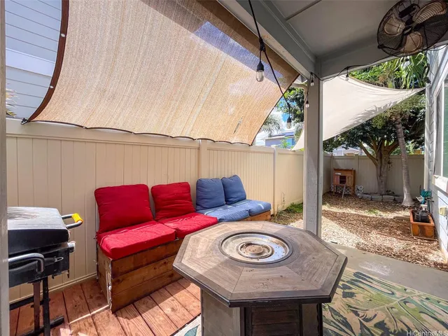 a view of a outdoor sitting area with furniture