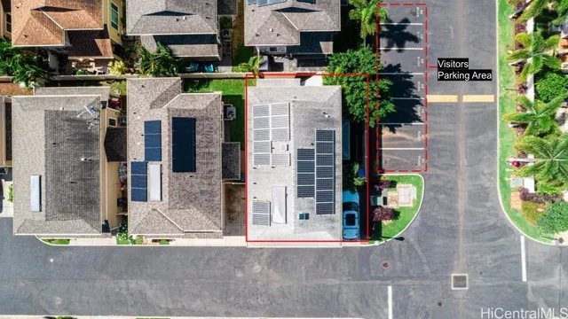 a view of a street with potted plants