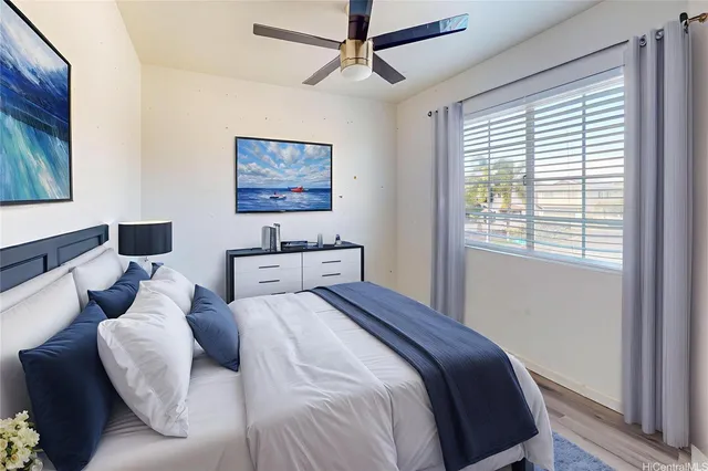 a bedroom with a large bed and a window