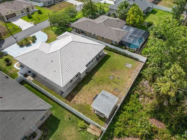 an aerial view of a house with outdoor space